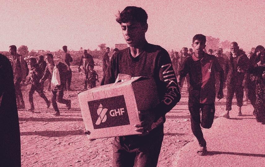 A young man carries aid supplies from the Gaza Humanitarian Foundation in the chaos surrounding the first distributions from the US- and Israeli-backed organisation.