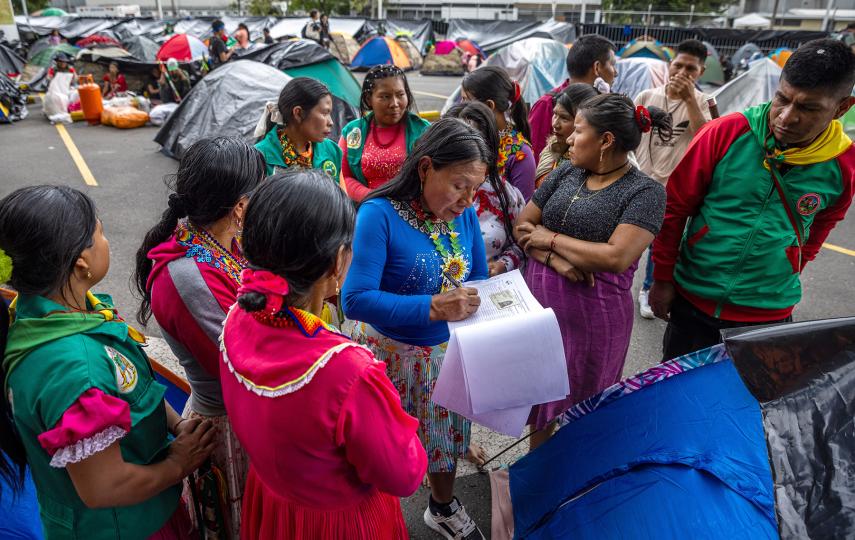 Embera Indigenous women from Chocó are pictured gathering as they join protests on 26 November 2024, demanding the government to honor an agreement to ensure access to land, health, housing, and food.
