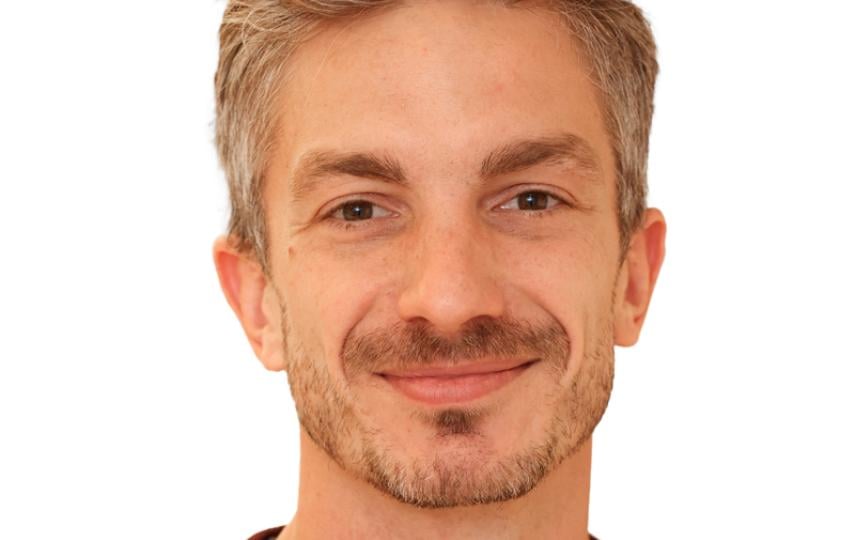 A headshot of Nicholas Pope.