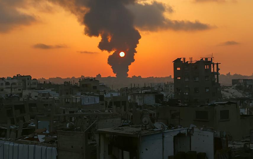 Smoke from an airstrike obscures the sun in Gaza.