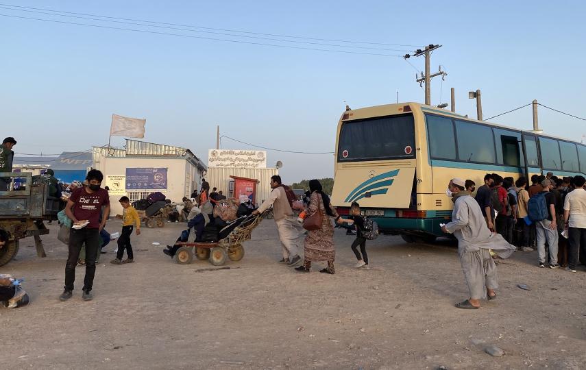 A bus is loaded with returnees at a processing centre near the Islam Qala border crossing in western Afghanistan in July. In 2024, 764,000 Afghans were deported from Iran.