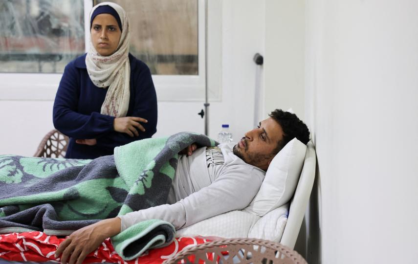 Mohamed Aly, 32, a Palestinian transferred from Gaza, lies on a bed at Al Arish hospital, amid a ceasefire between Israel and Hamas, in North Sinai, Egypt, February 11, 2025. 