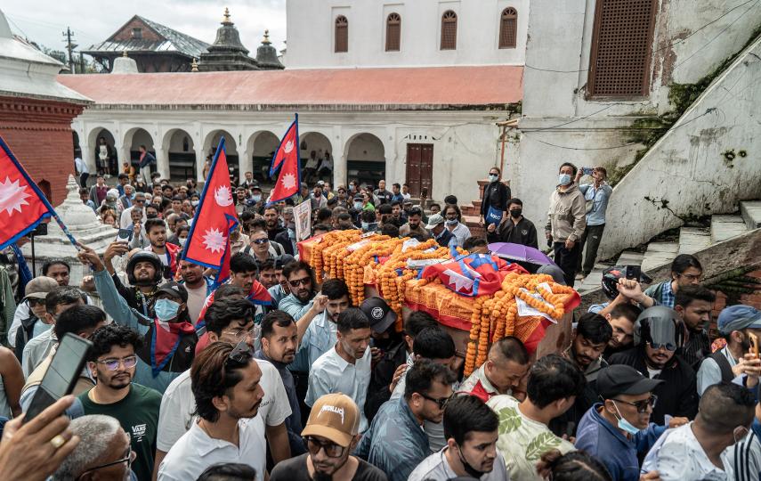 Volunteers and relatives carry the body of a Gen Z protester, honoured as a martyr, for final rites with state honours in Kathmandu, on 16 September 2025.
