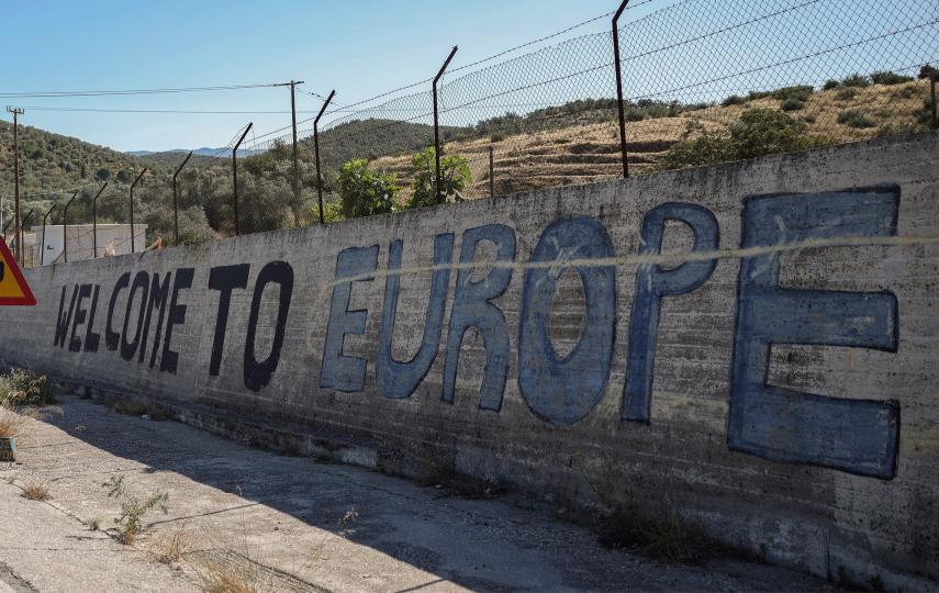 A message is written on a wall of the Moria refugee camp, burned in 2020, near the village of Moria, Lesbos island, Greece June 26,2025.