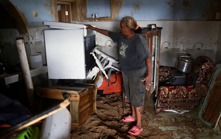 A resident shows a refrigerator at her house in the aftermath of Hurricane Melissa, in Santiago, Cuba, October 29, 2025.