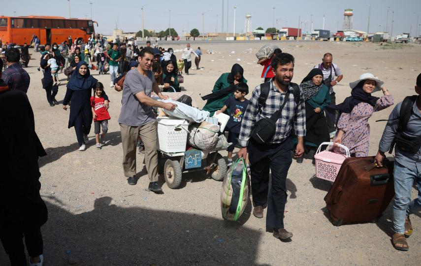 Afghans deported from Iran arrive at a camp for returning migrants near the Islam Qala border crossing in Herat province, Afghanistan, on 20 July 2025.