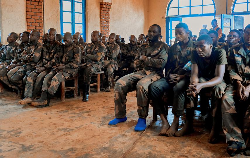 Members of the Congolese army deployed to fight M23 rebels attend a trial for allegedly abandoning their posts and committing crimes against the civilian population, including theft and rape, at a military court in eastern Democratic Republic of the Congo's Lubero territory, on 26 February 2025. (REUTERS/Gradel Muyisa Mumbere)
