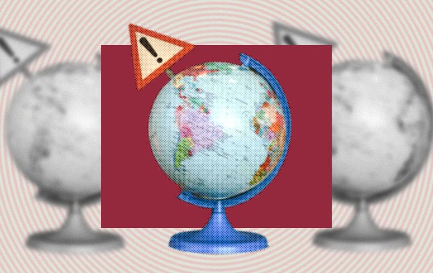 A stylised image showing a globe of Earth with a warning traffic sign.