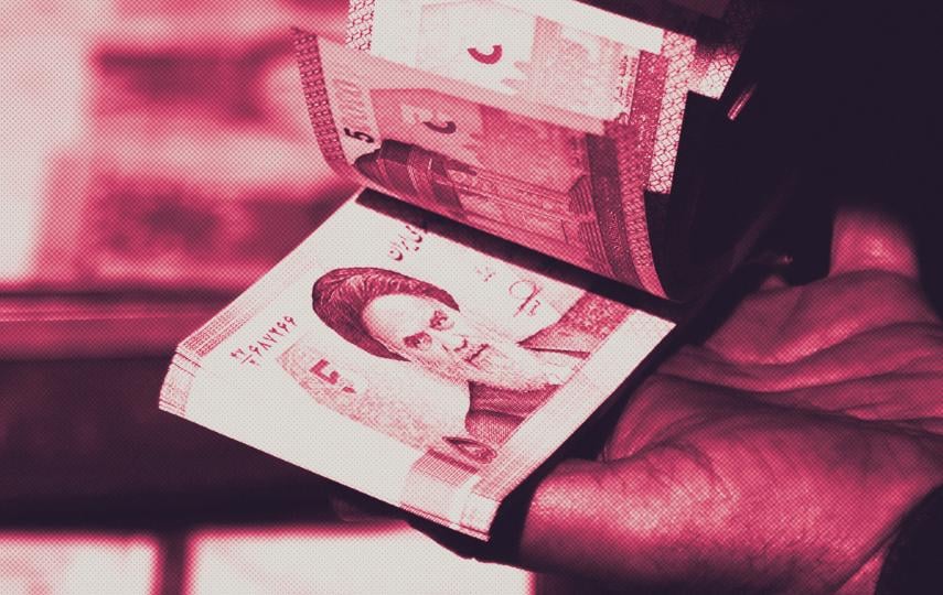 A stylised image showing a close up of hands counting money in Tehran, Iran on October 06, 2025.