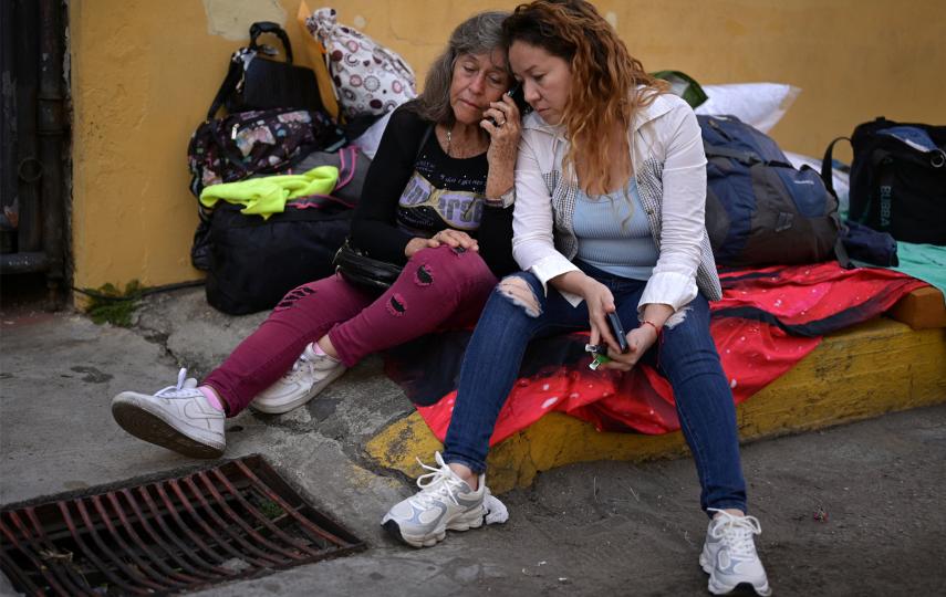Flor Zambrano waits with her daughter, Raidelis Chourio, for her son, Rene Chourio, outside the National Police Zone 7 Detention Centre as Venezuela's government begins releasing some detainees, with the freeing of political prisoners marking a move long demanded by human rights groups, international bodies and opposition leaders, in Caracas, Venezuela, January 13, 2026.