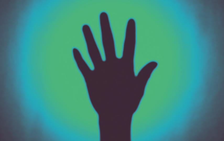 A photo of the silhouette of a hand reaching up.
