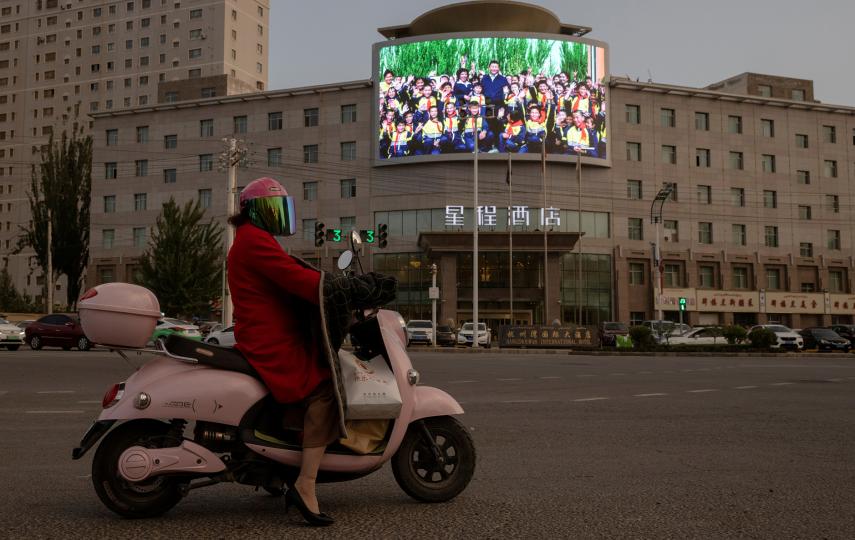 A screen shows a picture of Chinese President Xi Jinping at a traffic junction in Hotan, Xinjiang Uyghur Autonomous Region, China, April 30, 2021. Picture taken April 30, 2021.