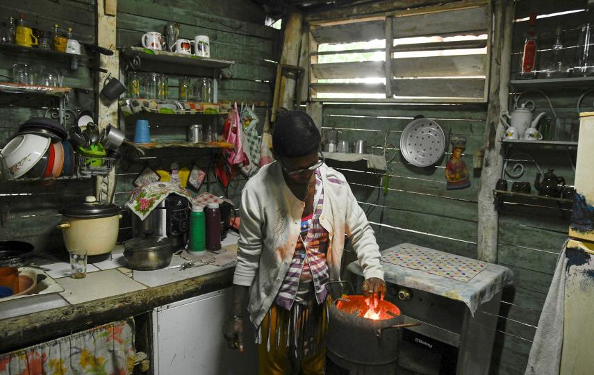 Deyanira Gonzalez uses charcoal to cook at home, after U.S. President Donald Trump vowed to stop Venezuelan oil and money from reaching the island as Cubans brace for worsening fuel shortages amid regular power outages, on the outskirts of Havana, Cuba January 12, 2026.