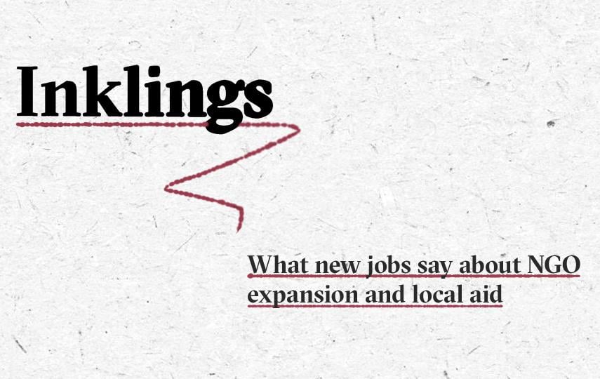 Image with the word “Inklings” in large black bold text, underlined with a dashed red line that curves downward in a zigzag shape. Below, in smaller black bold text, is the subtitle “What new jobs say about NGO expansion and local aid” also underlined with a dashed red line. The background is light grey with a subtle paper texture.