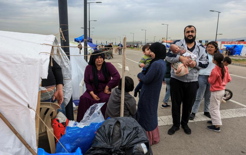 Mohamad Al Badran stands with his family, after fleeing Beirut’s southern suburbs, at a temporary encampment for displaced people, amid escalating hostilities between Israel and Hezbollah, as the U.S.-Israel conflict with Iran continues, in Beirut, Lebanon, April 1, 2026.
