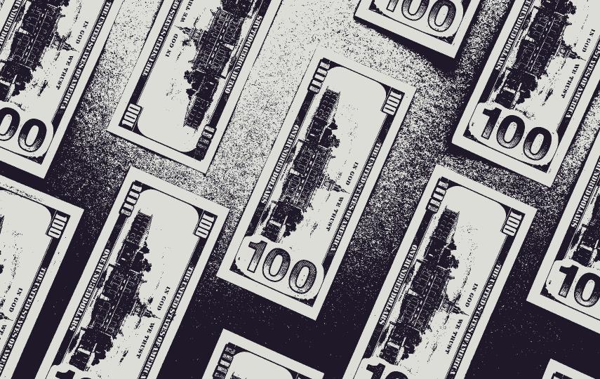 Several 100 dollar bills laid out with a contrasty filter. 