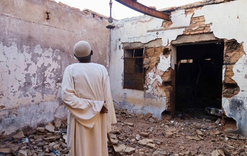 Hajj Ahmed, a resident of the Sudanese city of Omdurman, looks at his house after it was damaged by shelling, on 8 November 2024.