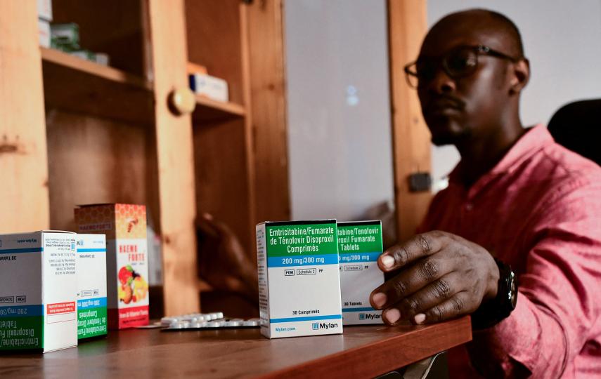 Andrew Tendo, 31, a medical clinic officer sits at his working station at the Ice Breakers Uganda (IBU) clinic in Makindye that supports HIV/AIDS programmes and treatment for the LGBTQ community in Salaama road, Kampala, Uganda 1 June 2023. 