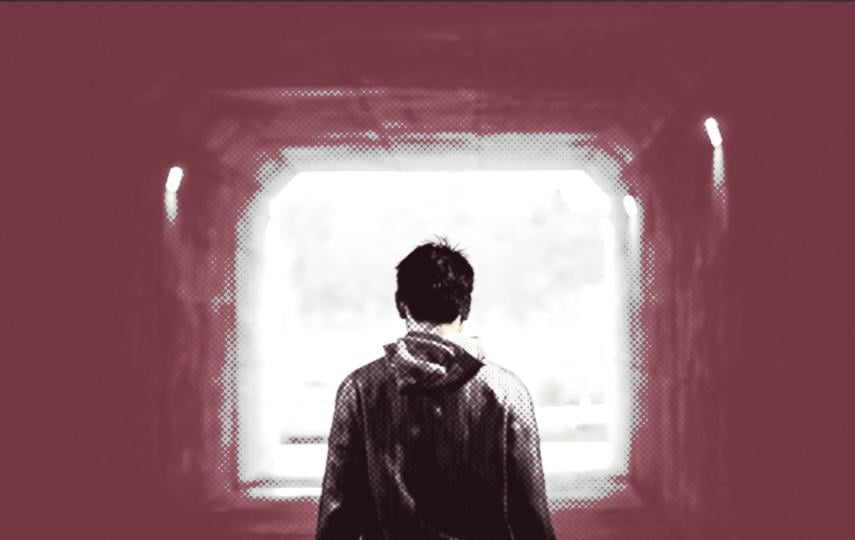 A graphic showing a person from behind facing the exit to a tunnel