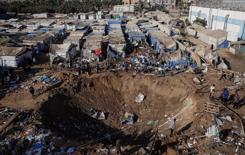 Displaced Palestinians inspect the destruction following an Israeli airstrike that destroyed medical supplies and pharmaceutical warehouses next to Al-Aqsa Martyrs Hospital in Deir al-Balah in the central Gaza Strip on 1 August 2026.