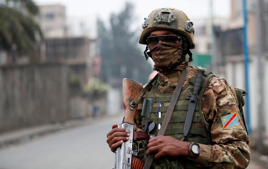 A member of the Rwanda-backed M23 rebel group stands guard as fighters take over Goma, the largest city in eastern Democratic Republic of the Congo, in January 2025. 