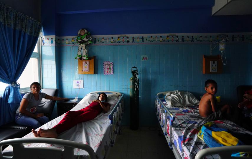 A blue room with hospital beds