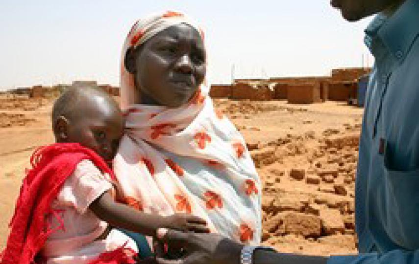 [Sudan] A Darfur IDP with her child sick with diarrhea in El Salaam Camp.