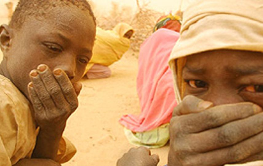 [Sudan] Darfurian boys and women shelter from the endless sandstorms along the Chad/Sudan border.