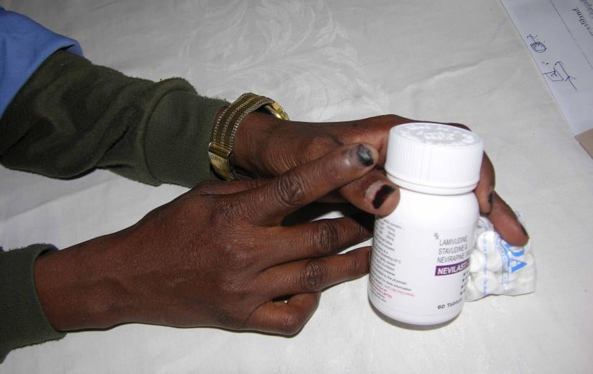 HIV positive mother of three Rahma Hirsi, 29, clutches the ARV drugs she receives at the Hargeisa Group Hospital in Hargeisa, Somaliland, August 2007.