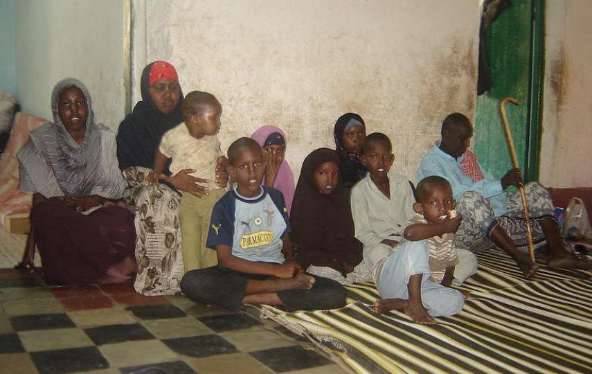 Zahra Abdille(in red scarf) sits with her children, Somalia, September 2007.