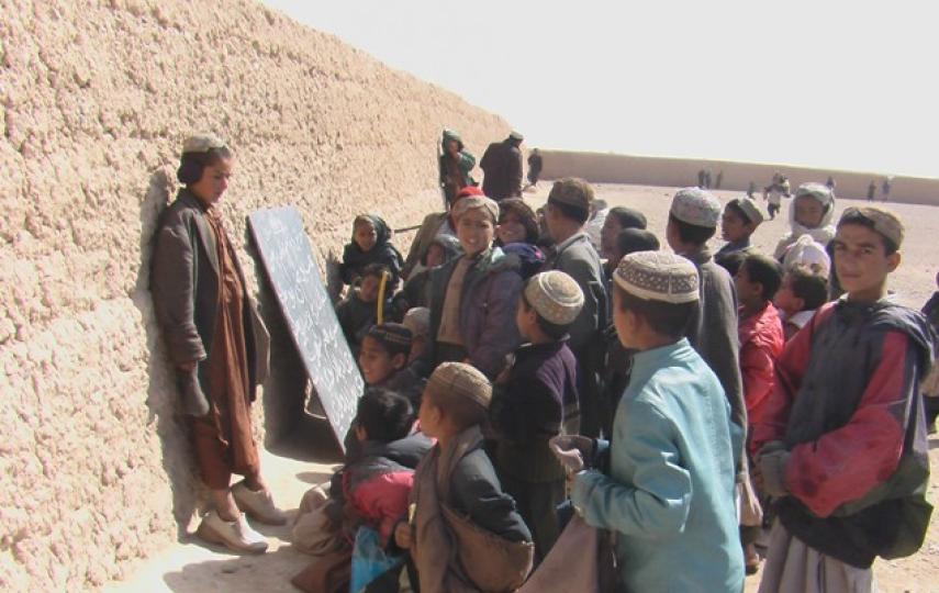 A school class in the open air of Helmand Province.