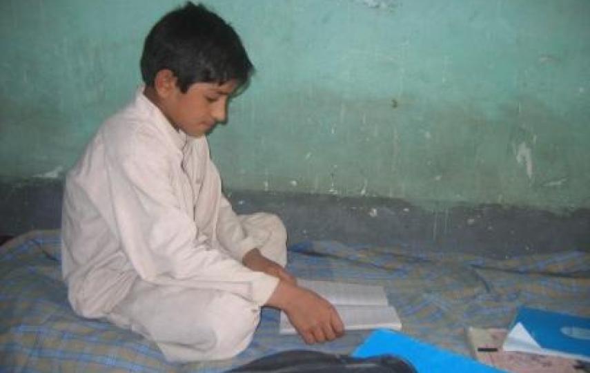 Abdul Bari, 13, risks his life to go to school in Lashkargah, after the Taliban burnt down the school in his village.
