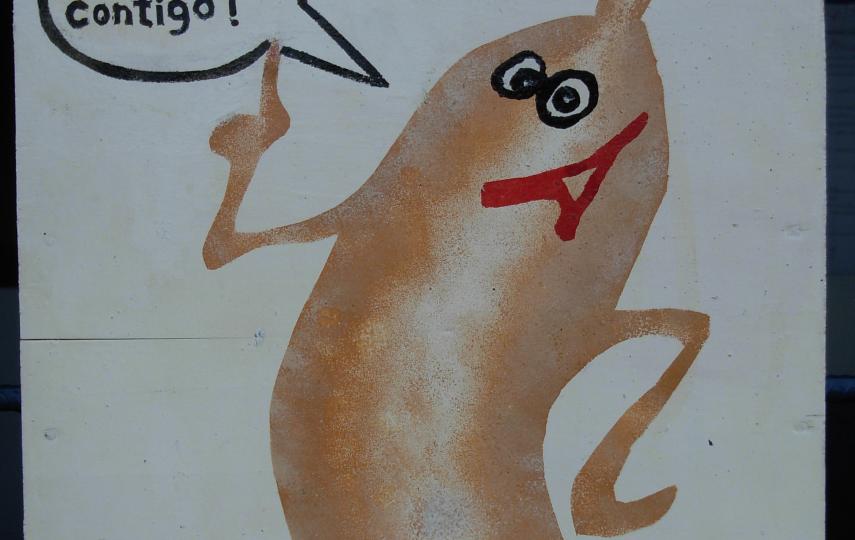 Sign in health center that says "Condoms distributed freely here".