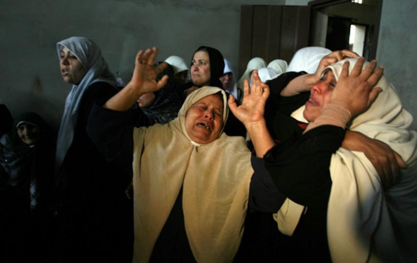 Palestinians mourn relatives during funerals in Gaza on 2 March. Five days of intense Israeli military activity in Gaza has left at least 115 Palestinians dead and over 300 wounded.