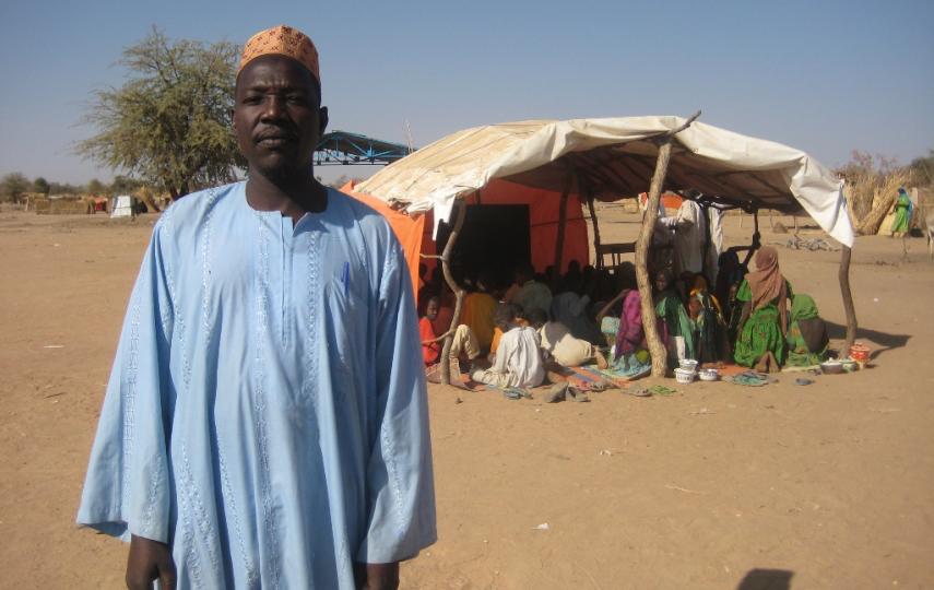 Zakaria Ousman, president of the parents’ association at a school for displaced Chadians, stands outside one of the makeshift classrooms. “The majority [of parents] do not know the importance of school,” he says.