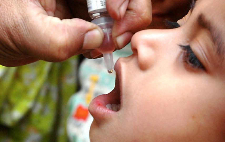 A young child receives polio drops in Pakistan. Pakistan is one of four countries in the world today where the disease remains endemic - the others being Afghanistan, Nigeria, and India.