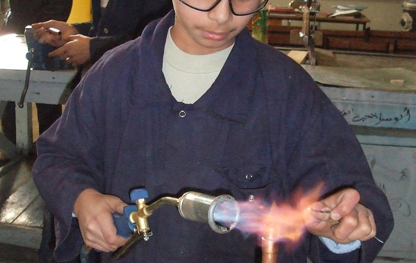 Ibrahim Sayyid studied for his exams while living in a tent in al-Tanf camp. Having passed his exams, the 15-year-old now studies plumbing in Damascus.