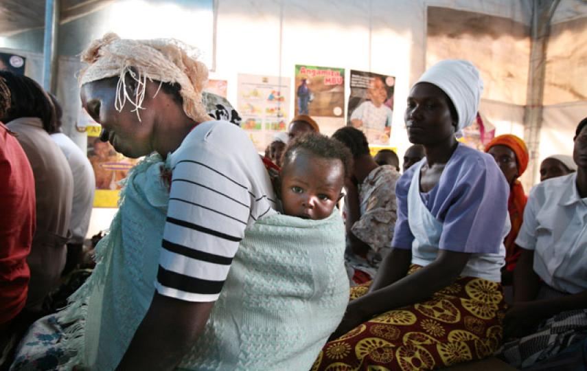 An HIV-positive IDP mother and child participate in a gathering organized by the Society for Women Against AIDS in Kenya (SWAK), at Nakuru IDP camp April 2008..Thousands of Kenyans who dropped out of HIV treatment programmes as a result of the country's p