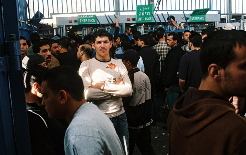 Palestinians wait at the Qalandia checkpoint outside Ramallah during a closure in the West Bank.