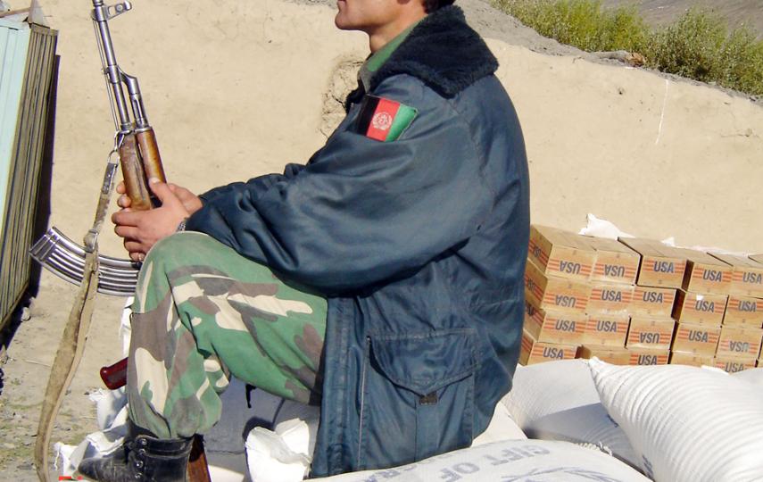 An armed guard travels with a previous WFP food consignment.