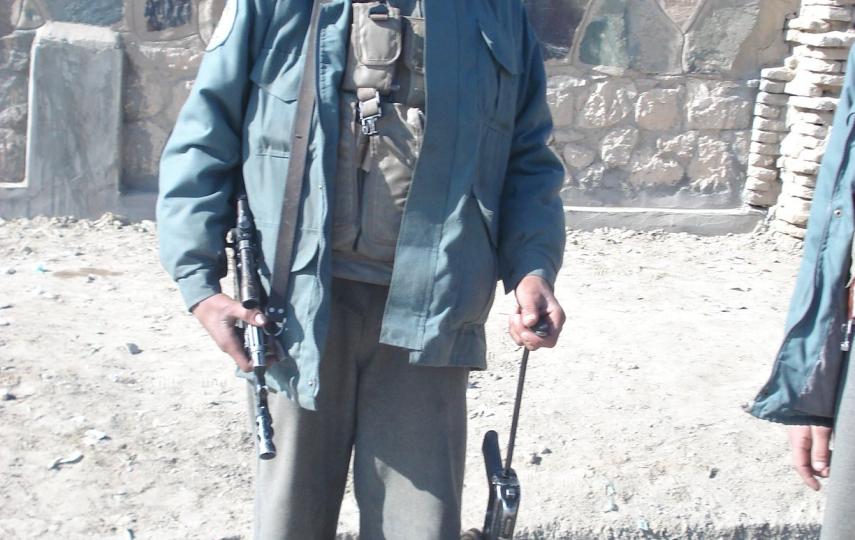 An Afghan boy in police uniform in Kandahar province in November 2007. According to the UN, children are also recruited within the ranks of Afghan National Police and other pro-government militias.