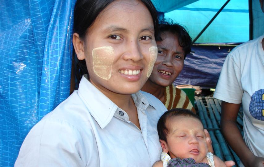 A young woman and her newborn baby at a displaced persons camp outside cyclone-affected Labutta.