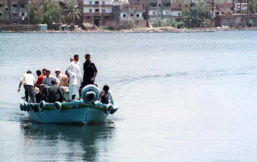 A ferry crossing from one side of the Nile to the other in the coastal city of Rashid, where migrants continue their journey into the Mediterranean Sea.