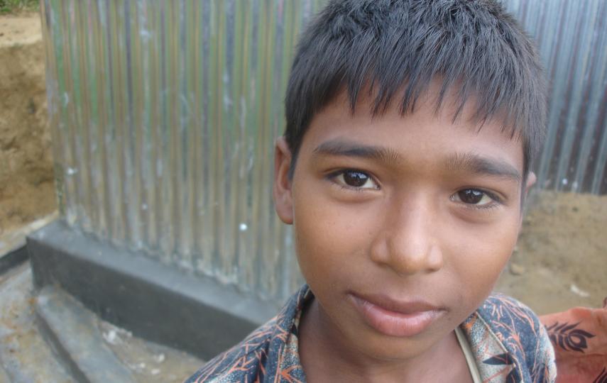 A Rohingya boy looks to the camera in southern Bangladesh. There are upwards of 200,000 Rohingya in the country, many of whom fled Myanmar in 1991.