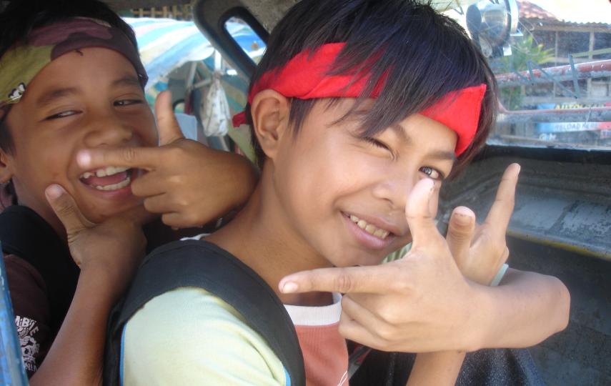 Boys smile to the camera on the conflict-affected island of Mindanao. The southern Philippine island has seen an upsurge in separatist violence since August 2008