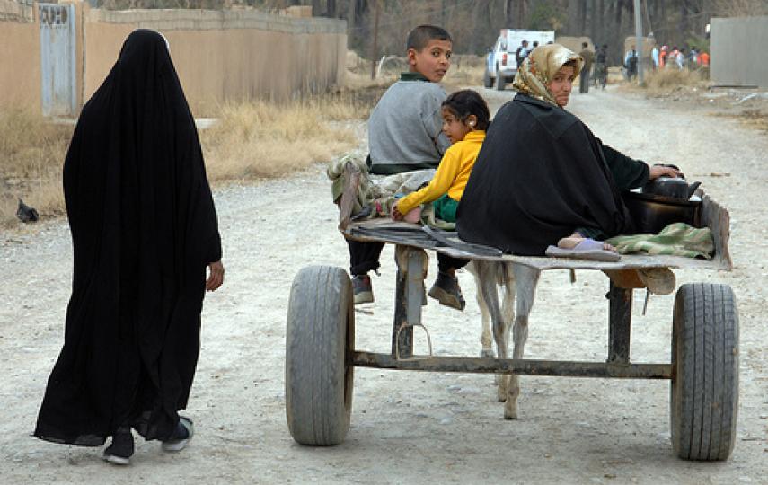 An Iraqi family returns to their village in Burah, Diyala Province, after being displaced for months by insurgents