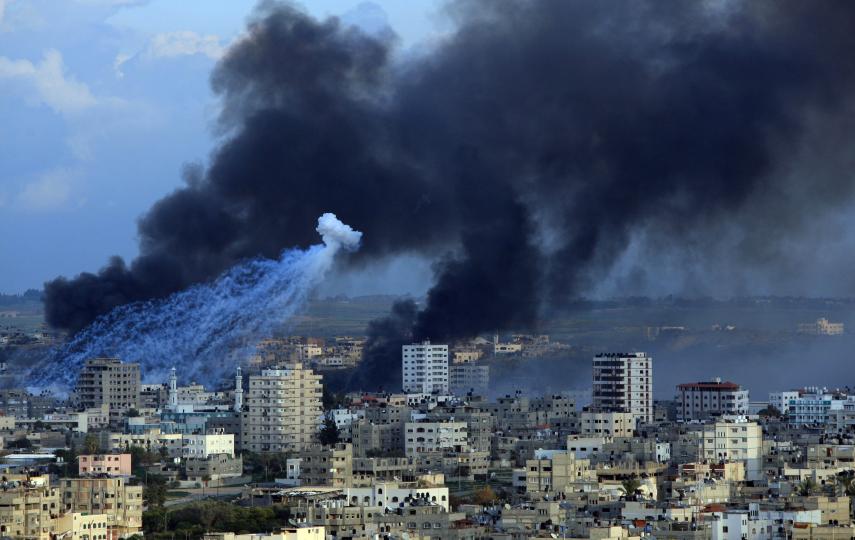Fire and smoke billow following an Israeli airstrike in the southern Gaza Strip town of Rafah near the border with Egypt