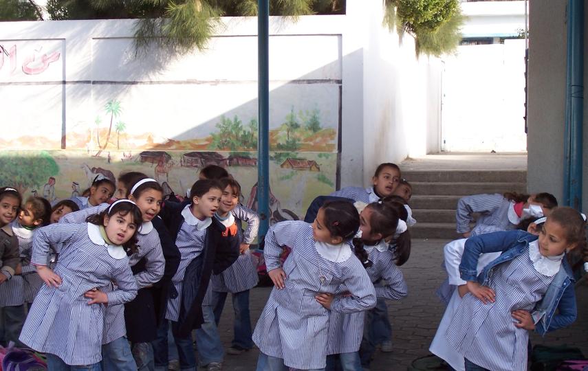 First graders at Asma Co-ed Eementary School “A&B” in Gaza City, run by UNRWA, participating in stress-relieving games and activities to recover from psychosocial trauma incurred during the war