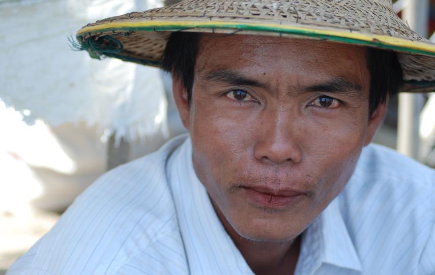 A man in Myanmar's cyclone affected Ayeyarwady Delta. More than one year on, huge humanitarian challenges remain