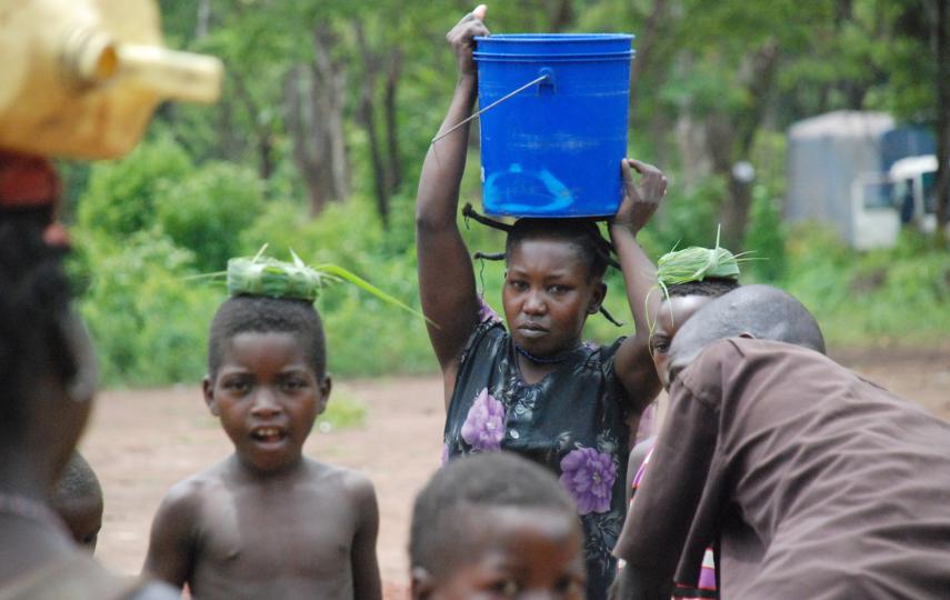 Refugees from the Democratic Republic of the Congo collect water at the Makpandu refugee camp in Southern Sudan's Western Equatoria region, in this May 2009 photograph. The refugees fled attacks from the LRA